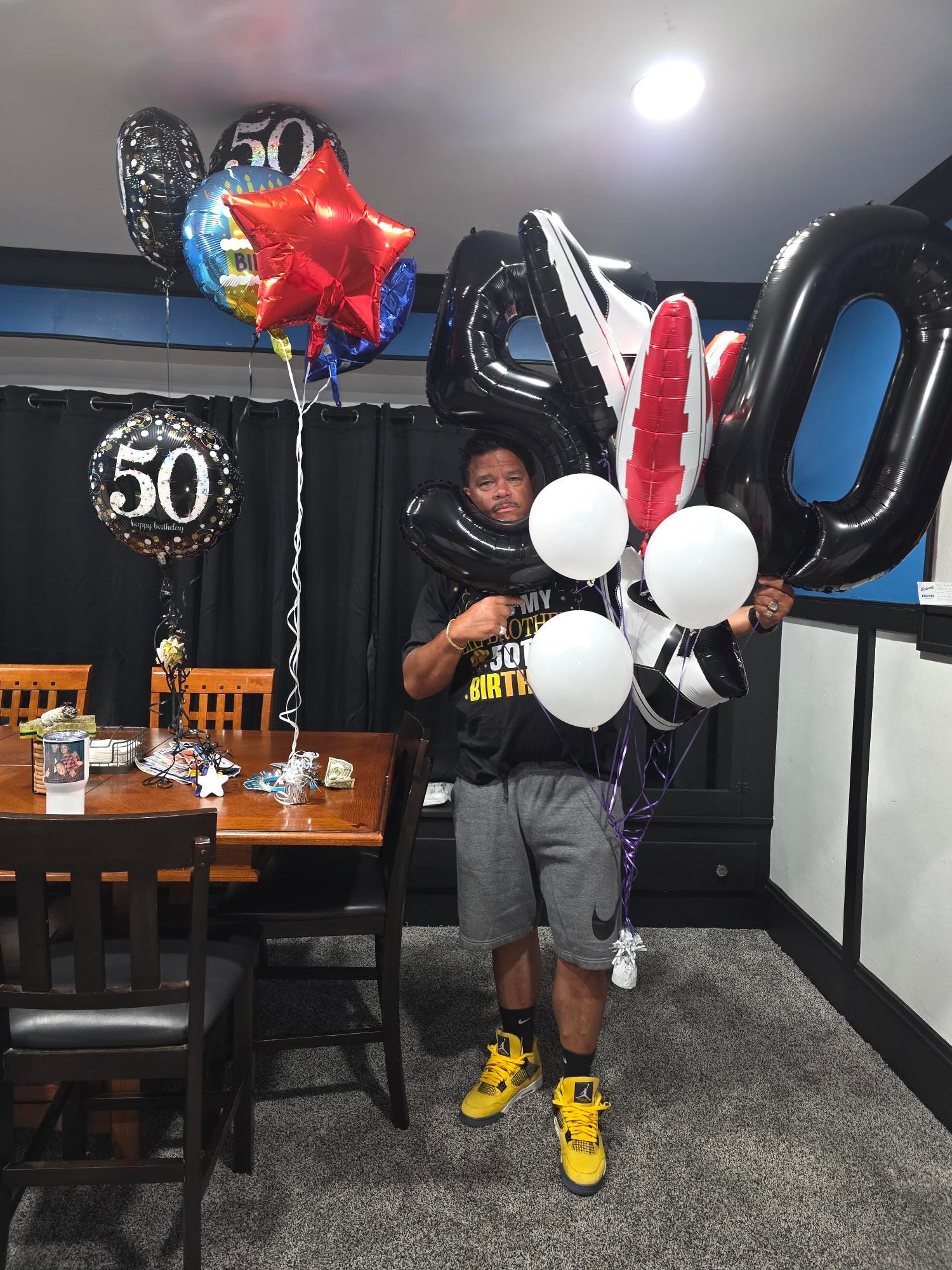 Jason Rush celebrating 50 vehicle sales at Ken Ganley Chevrolet Brook Park